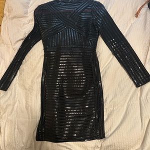 This sexy dress is fitted like a glove. With sheer and rubber material.